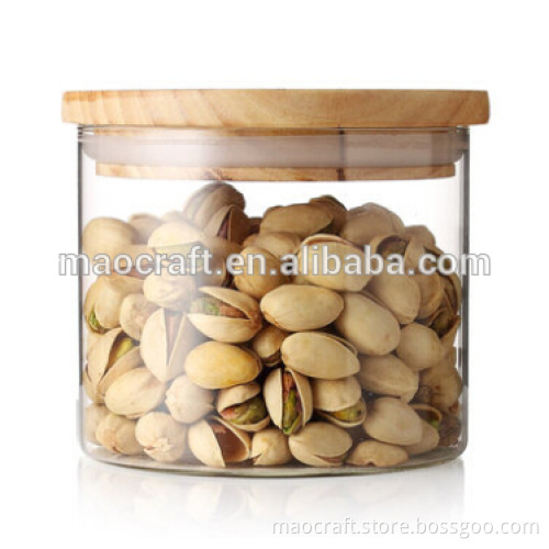 Clear glass canister with bamboo lid, wood lid, colored tin lid